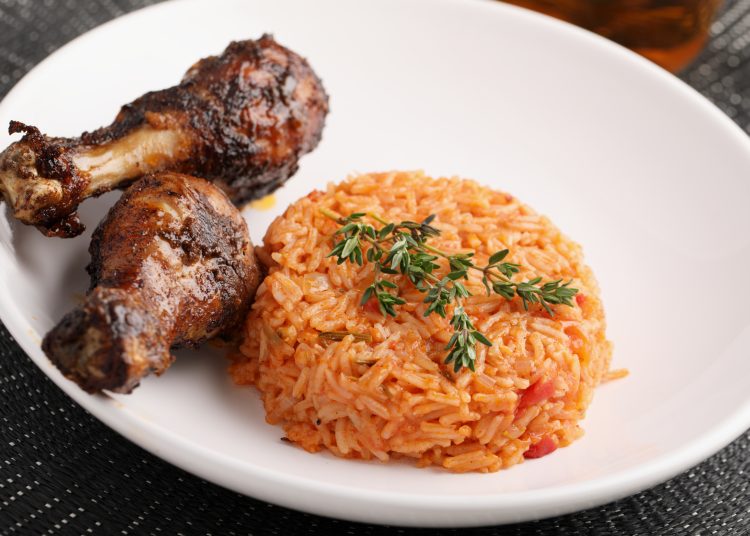Nigerian,Jollof,Rice,With,Roasted,Chicken,Thigh,And,Thyme