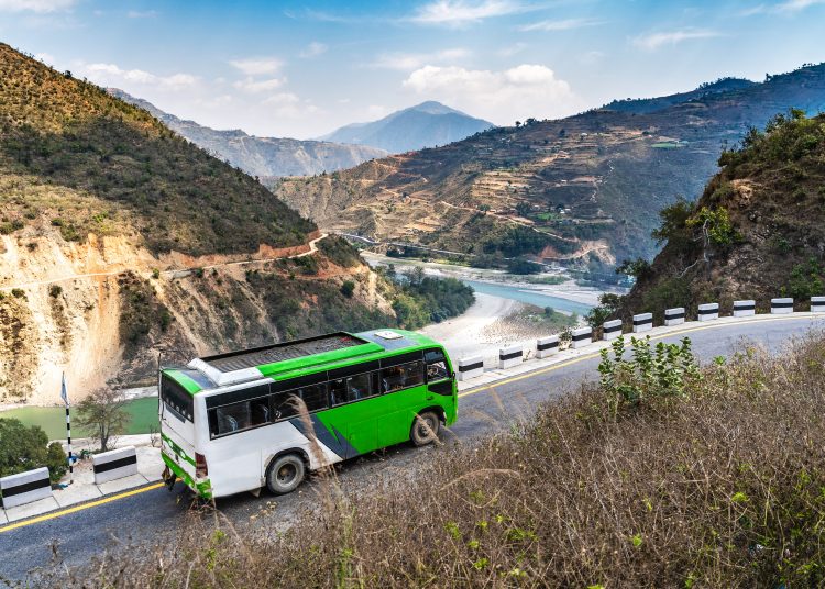 A,White green,Bus,Moves,Along,The,Serpentine,Mountain,Road,Against