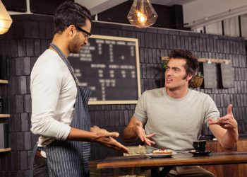 Waiter,And,Customer,Having,A,Discussion,In,A,Coffee,Shop