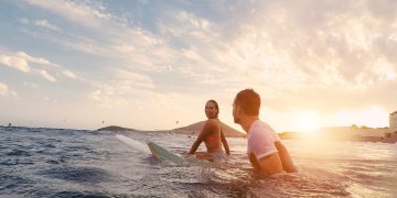 Fit,Couple,Surfing,At,Sunset, ,Surfers,Friends,Having,Fun