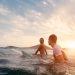 Fit,Couple,Surfing,At,Sunset, ,Surfers,Friends,Having,Fun