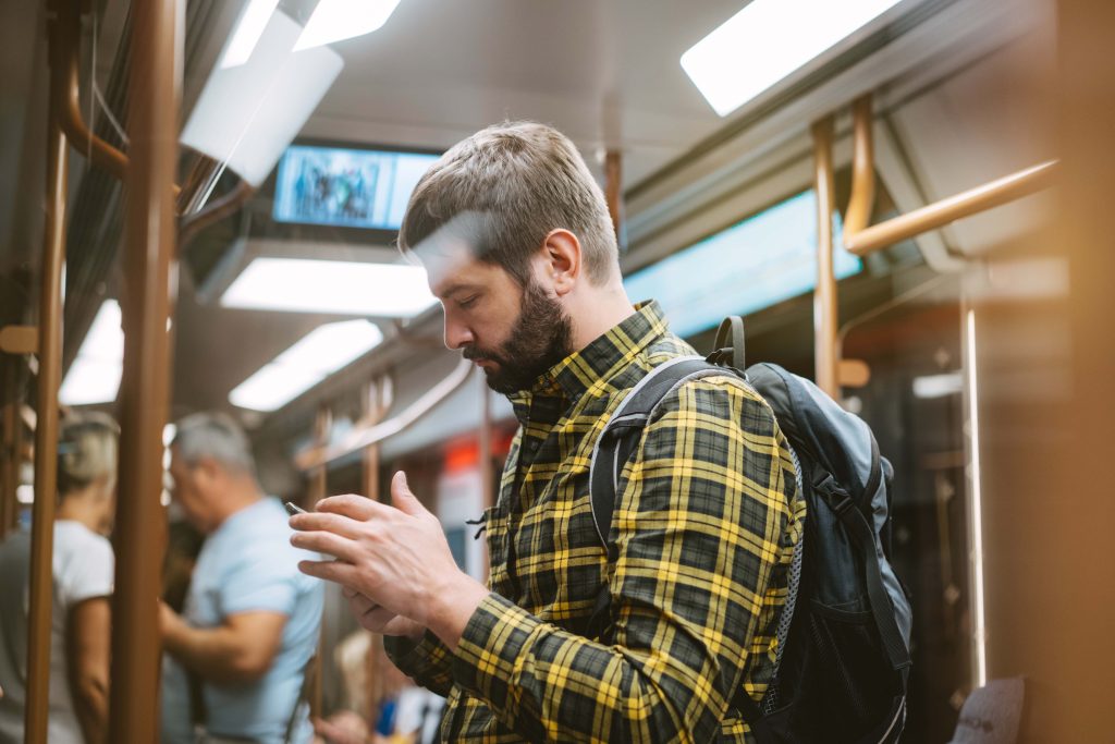 Caucasian,Man,In,Checkered,Plaid,Shirt,With,Backpack,Traveling,By