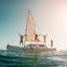 Blurred,Crazy,Friends,Diving,From,Sailing,Boat,Into,The,Sea