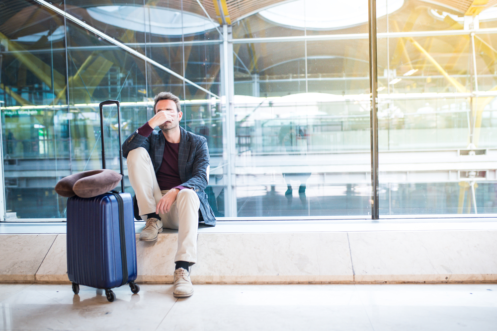 Man,Upset,At,The,Airport,His,Flight,Is,Delayed